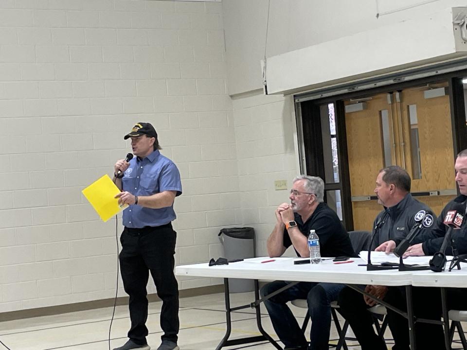 Rep. William Bruck, R-Erie, (standing) speaks to the audience at one of Wednesday's town hall meetings.