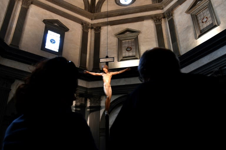 A wooden crucifix scupted by Michelangelo has been restored and returned to Florence's Santo Spirito church