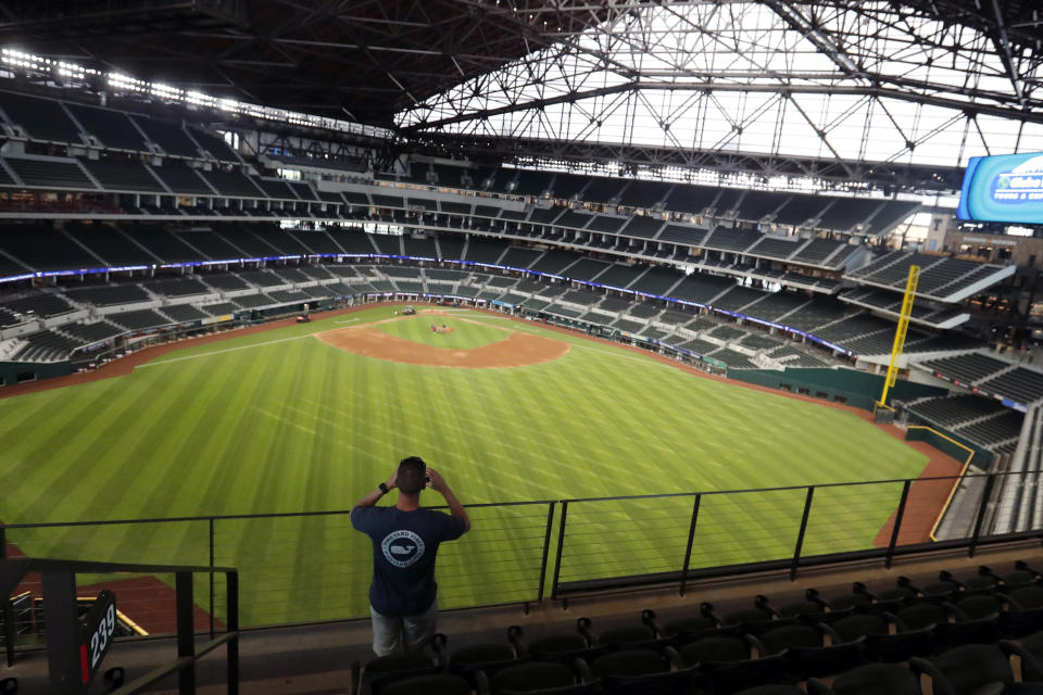 Baseball fan Mark Southard, of Wichita Falls, Texas, takes a photo during a tour of Globe Life Field, the new home of the Texas Rangers baseball team, Monday, June 1, 2020, in Arlington, Texas. (AP Photo/LM Otero)