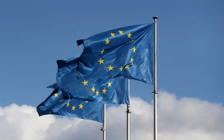 European Union flags fly outside the EU Commission headquarters in Brussels