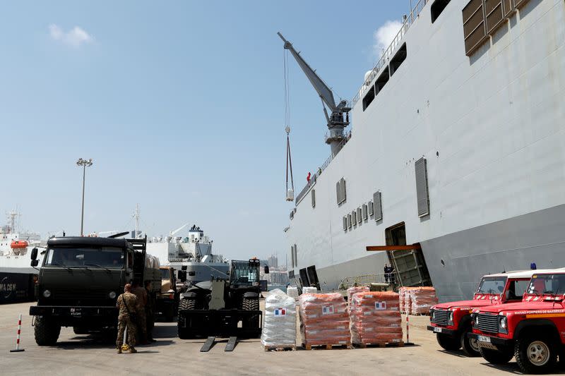 French navy helicopter carrier Tonnerre delivers material and personnel to assist in clearing operations after the explosion, in Beirut