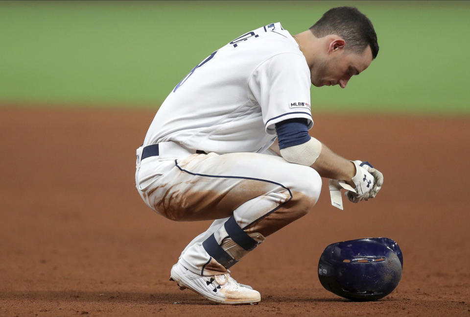 Tampa Bay Rays' Brandon Lowe reacts after popping out to end the eighth inning of the team's baseball game against the Texas Rangers on Friday, June 28, 2019, in St. Petersburg, Fla. The Rangers won 5-0. (AP Photo/Mike Carlson)