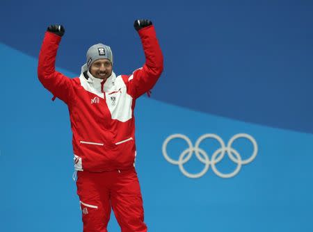 Feb 18, 2018; Pyeongchang, South Korea; Gold medalist Marcel Hirscher (AUT) celebrates during the medals ceremony for the men's alpine skiing giant slalom in the Pyeongchang 2018 Olympic Winter Games at Medals Plaza. Mandatory Credit: Kevin Jairaj-USA TODAY Sports