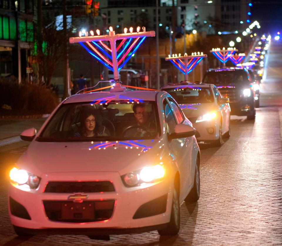 Brandon and Lindsay Katzir take part in the 2020 "Procession of Lights" coordinated during Hanukkah by Chabad Community Center. 
(Credit: DOUG HOKE, Doug Hoke/The Oklahoman)