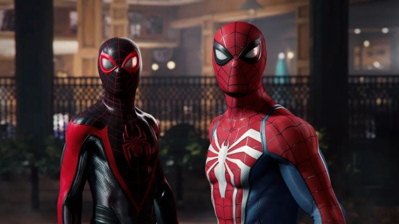 Miles Morales and Peter Parker are seen wearing their Spider-Man suits and looking at something in the distance.