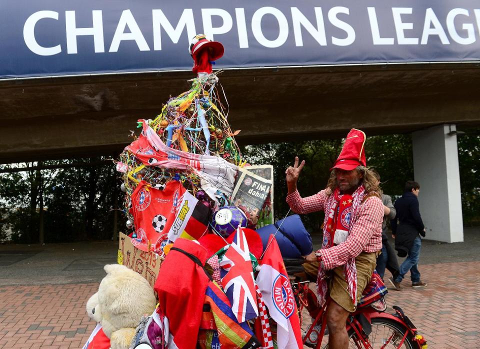 A Bayern Munich fan and his wacky and wonderful wonder bicycle outside Webley Stadium before the game.