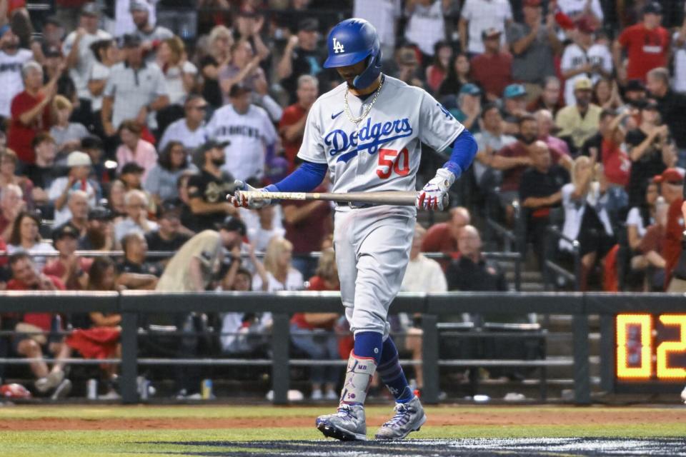 Dodgers' Mookie Betts walks away from the plate after striking out against the Arizona Diamondbacks on Oct. 11, 2023.