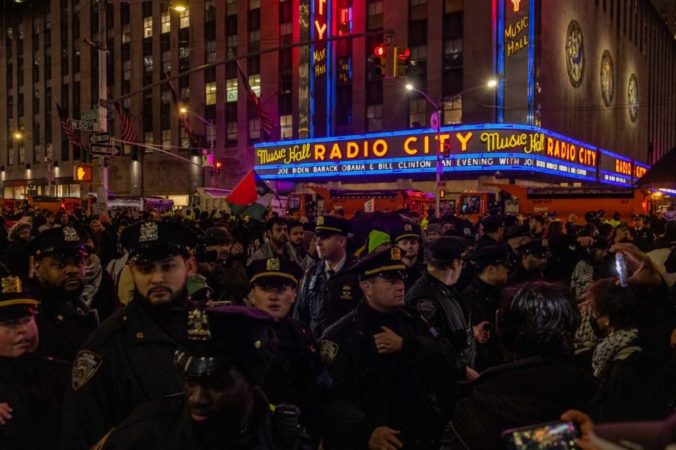 NYPD officers block pro-Palestinian demonstrators outside Radio City Music Hall during the fundraiser (Getty Images)