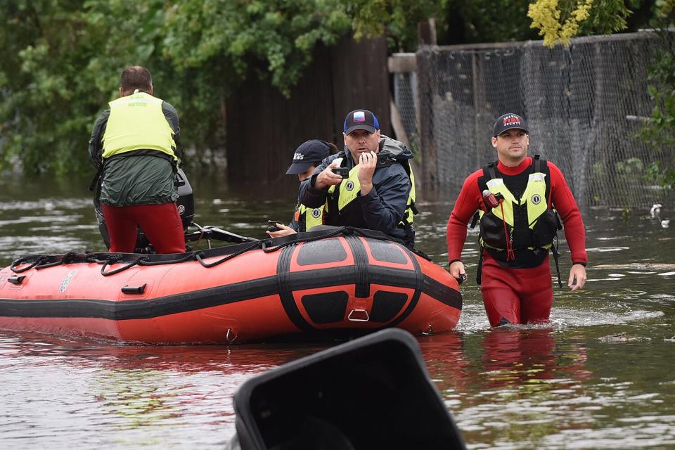Orange County Fire rescue unit members work in a flooded neighborhood in the aftermath of Hurricane Ian on September 29, 2022 in Orlando, Florida. The storm has caused widespread power outages and flash flooding in Central Florida as it crossed through the state after making landfall in the Fort Myers area as a Category 4 hurricane.