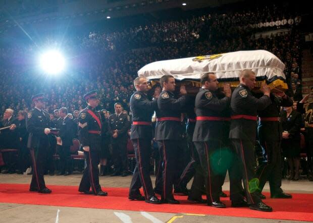 Czapnik's casket is carried from his funeral service in Ottawa on Jan. 7, 2010. 