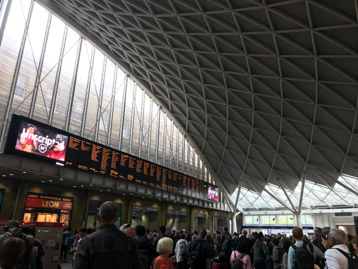 People waiting for trains at King's Cross station, London, after all services in and out of the station were suspended on Friday when a power cut caused major disruption across the country. PRESS ASSOCIATION Photo. Picture date: Saturday August 10, 2019. See PA story ENERGY PowerCut. Photo credit should read: Abbianca Makoni/PA Wire 