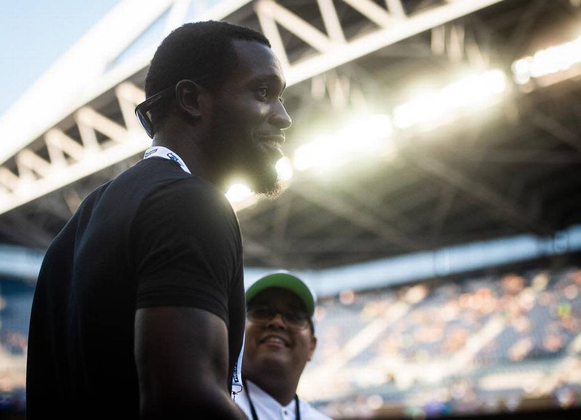 Kam Chancellor walks along the sideline before a Seahawks preseason game against the Indianapolis Colts on Aug. 9, 2018. He spent much of the 2018 season as a mentor for Seattle’s players while essentially retired because of a career-ending neck injury he sustained in a 2017 game.