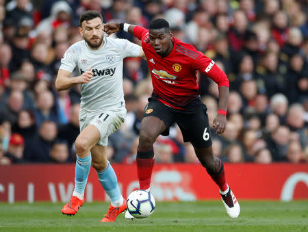 Soccer Football - Premier League - Manchester United v West Ham United - Old Trafford, Manchester, Britain - April 13, 2019 West Ham's Robert Snodgrass in action with Manchester United's Paul Pogba Action Images via Reuters/Carl Recine