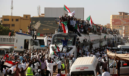 A train carrying protesters from Atbara, the birthplace of an uprising that toppled Sudan's former President Omar al-Bashir, approaches to a train station as part of a symbolic gesture of support for demonstrators camped at a sit-in outside the defence ministry compound, in Khartoum, Sudan, April 23, 2019. REUTERS/Umit Bektas