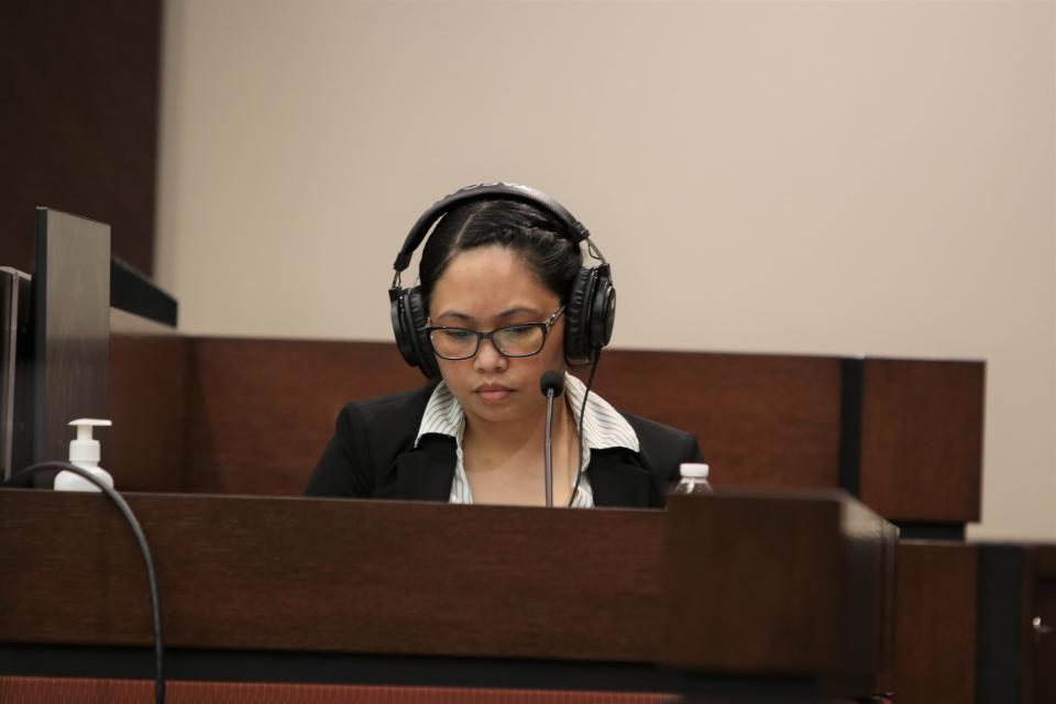 Katherine Magbanua listens to a recording during her murder trial n the Leon County Courthouse on Thursday, May 26, 2022.