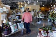 Martin Garcia, owner of gift and décor store Gramercy Gift Gallery, poses for a photo at his shop, Wednesday, June 29, 2022, in San Antonio. Landlords were forgiving about rent during the first two years of the pandemic, but now many are asking for back due rent. Meanwhile, most of the government aid programs that helped small businesses get through the pandemic have ended. (AP Photo/Eric Gay)