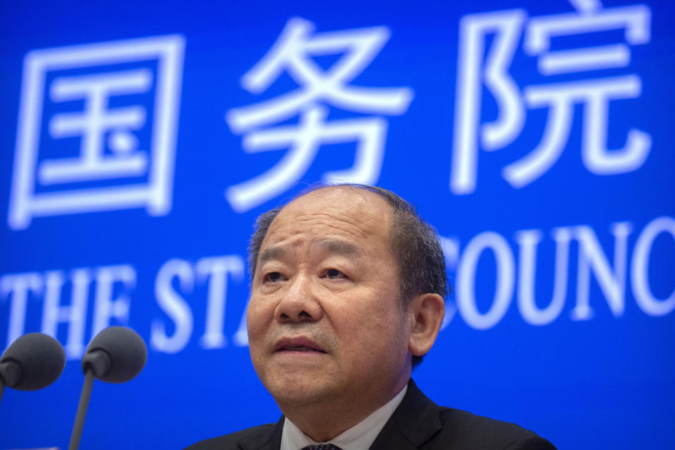 Ning Jizhe, commissioner of China's National Bureau of Statistics, speaks during a press conference at the State Council Information Office in Beijing, Tuesday, May 11, 2021. China's population growth is falling closer to zero as fewer couples have children, the government announced Tuesday, adding to strains on an aging society with a shrinking workforce. (AP Photo/Mark Schiefelbein)