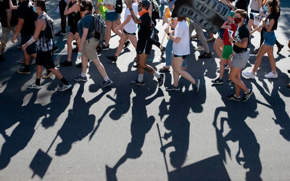 Protesters from NC Born depart the North Carolina State Capital and mach down Salisbury Street on their way to Nash square for a rally on prison reform on Saturday, June 13, 2020 in Raleigh, N.C.