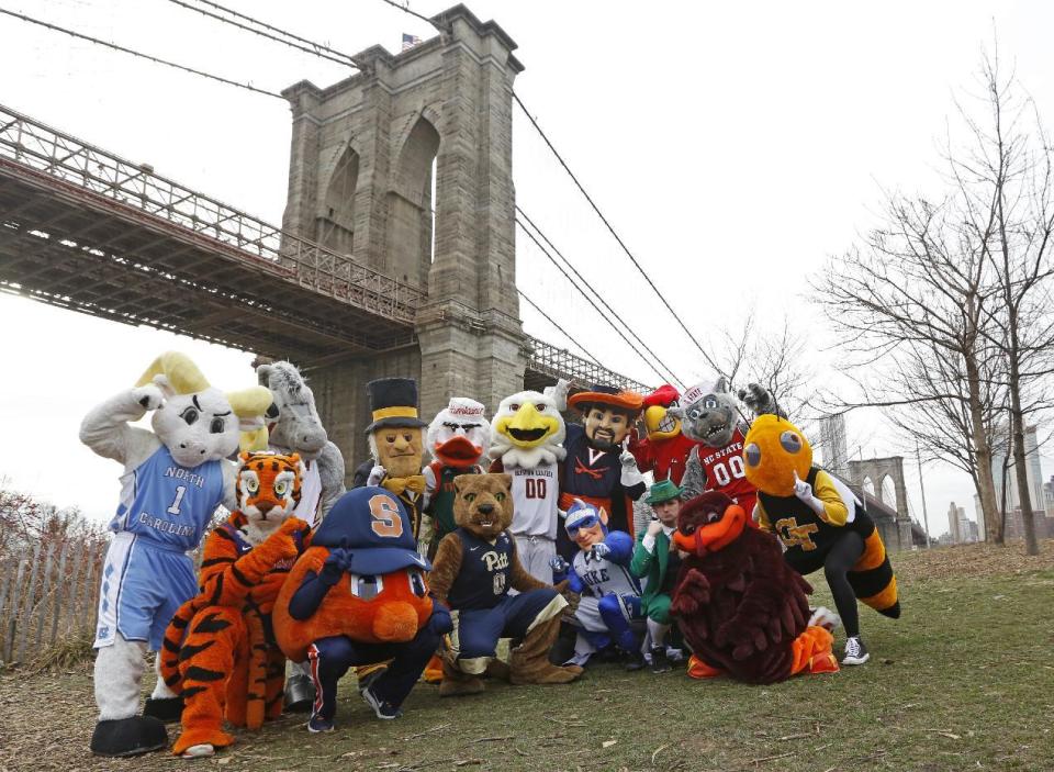 All 15 of the Atlantic Coast Conference's mascots pose for a group photograph, Monday, March 6, 2017, beneath the Brooklyn Bridge in New York. The mascots were promoting the ACC basketball tournament March 7-11 at the Barclays Center in Brooklyn. (AP Photo/Kathy Willens)
