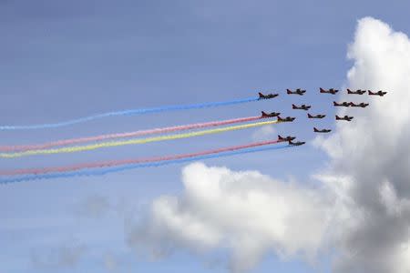 Aircraft from the Philippine Air Force perform during the 80th founding anniversary of the Armed Forces of the Philippines held inside Clark Air Base, formerly a U.S. base, in Angeles city, Pampanga province, north of Manila December 21, 2015. REUTERS/Romeo Ranoco