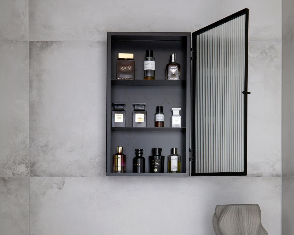 Organizing a medicine cabinet black cabinet on grey wall