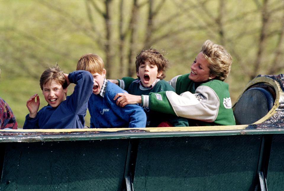 Princess Diana with Prince William (left), Prince Harry and a friend at an amusement park in 1994. (Photo: Julian Parker via Getty Images)