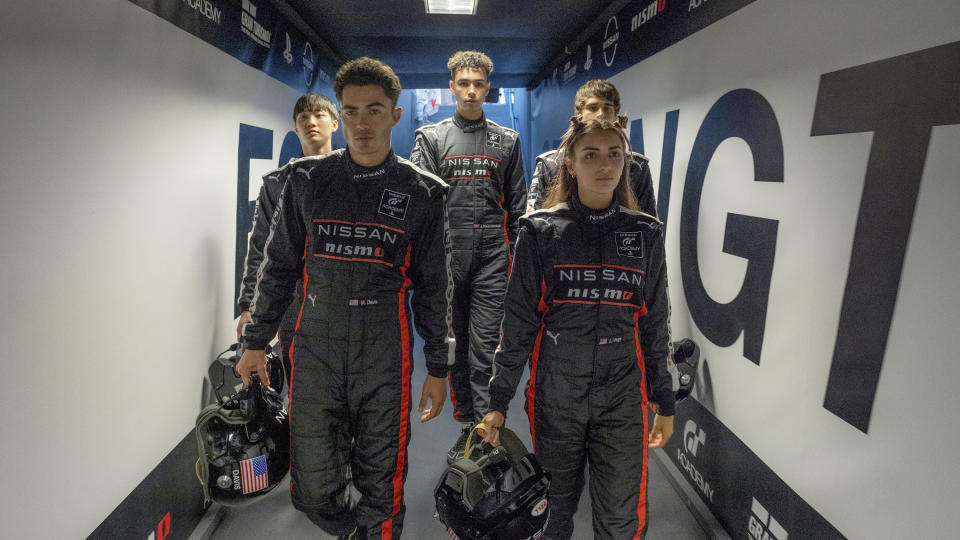 This image released by Columbia Pictures shows, from left, Sang Heon Lee, Darren Barnet, Archie Madekwe, Emelia Hartford and Pepe Barroso Silva in a scene from "Gran Turismo." (Gordon Timpen/Columbia Pictures/Sony Entertainment via AP)