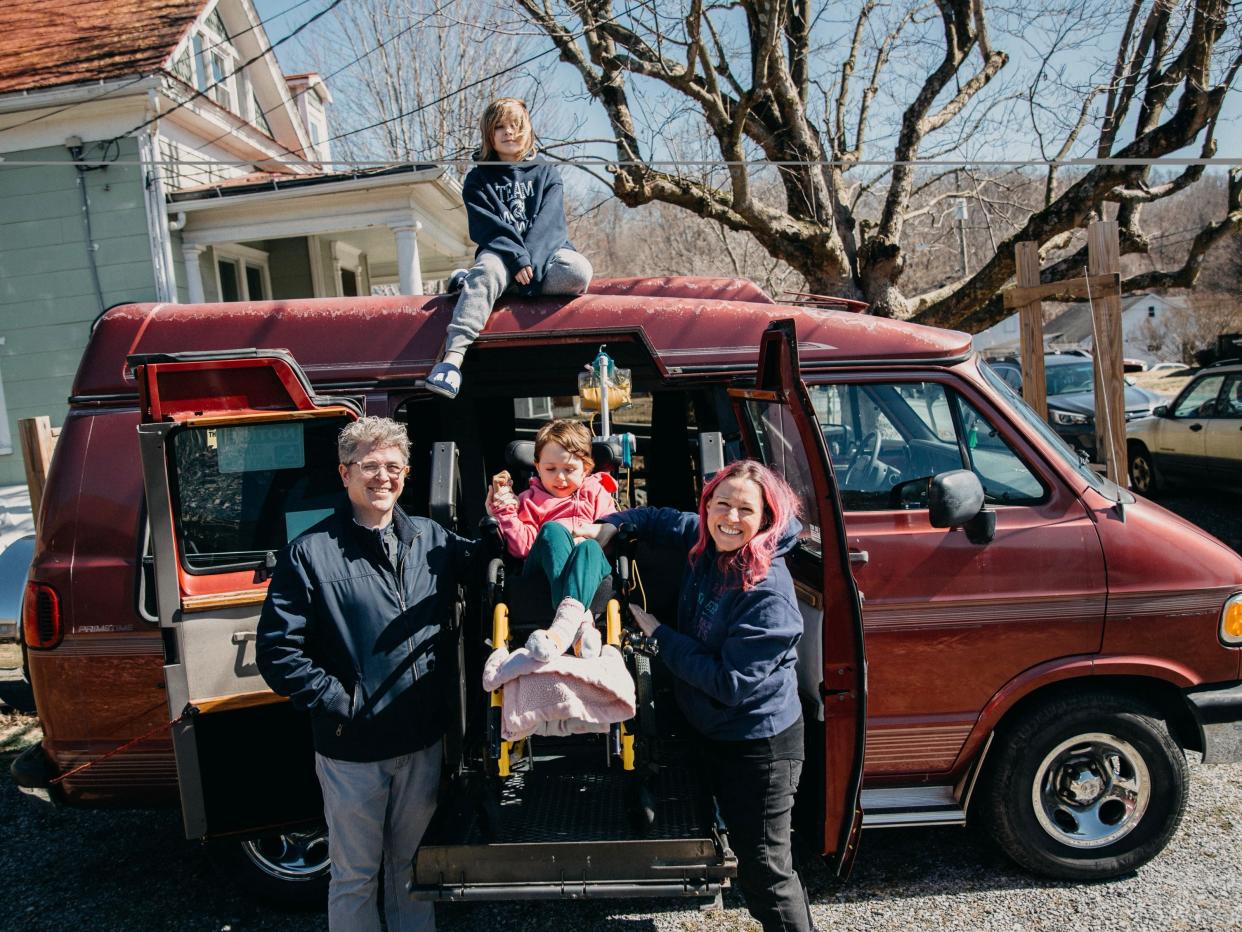 A fundraiser recently helped the Burrows family raise money for a wheelchair-accessible van. Standing with the van are Daniel Burrows, Cordelia Burrows and Miriam Burrows. Clark Burrows is on top of the van.