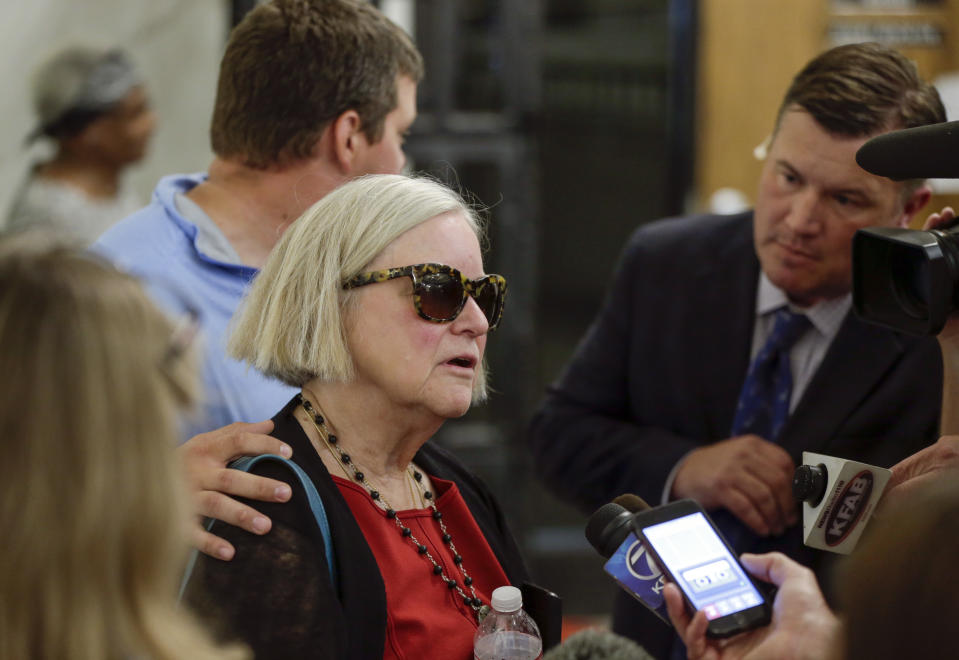 Dr. Claire Hunter, mother of Thomas Hunter, speaks to reporters outside the Douglas County Court in Omaha, Neb., Friday, Sept. 14, 2018, after former doctor Anthony Garcia, convicted in the revenge killings of four people connected to a Nebraska medical school, was sentenced by a three-judge panel to death. Garcia was convicted in two attacks that occurred five years apart. The first victims were Thomas Hunter and a housekeeper of a faculty member at Creighton University School of Medicine in Omaha. Garcia also was found guilty in the 2013 deaths of another Creighton pathology doctor and his wife. (AP Photo/Nati Harnik)