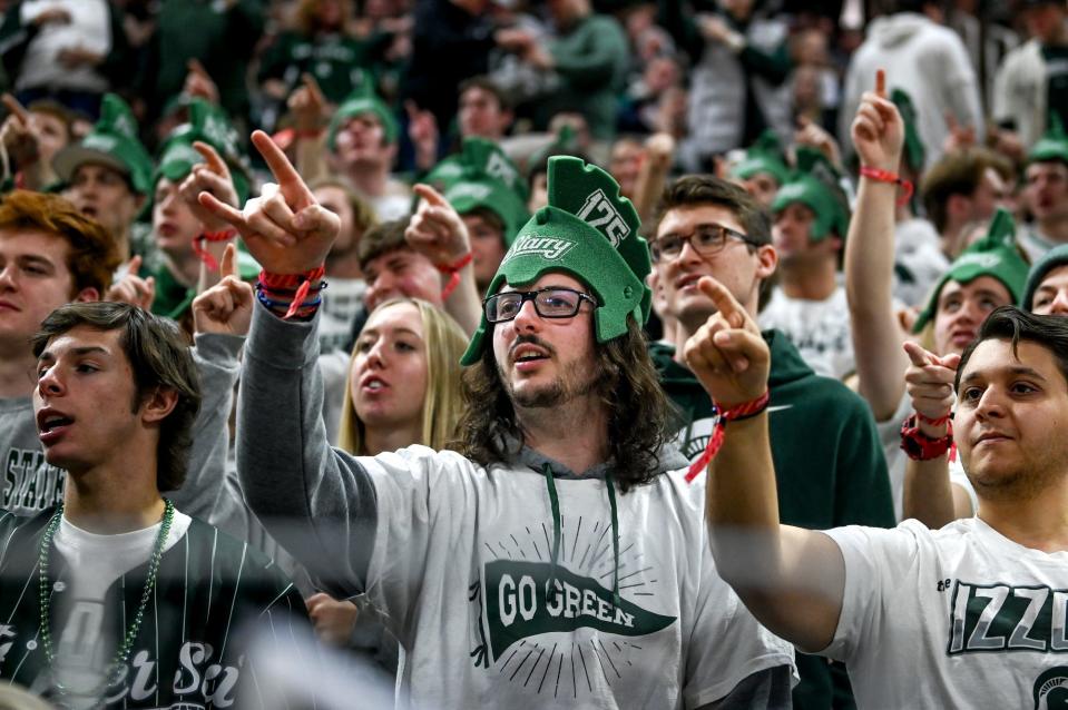 Izzone fan Vasilios Dionyssopiulos, center, cheers for the Spartans during the game against Maryland on Saturday, Feb. 3, 2024, at the Breslin Center in East Lansing.