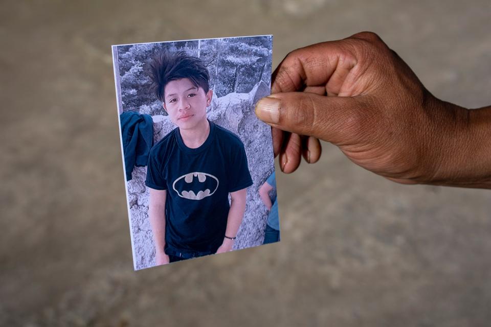 A man shows a portrait of Wilmer Tulul, in Tzucubal, Guatemala, Wednesday, June 29, 2022 (Copyright 2022 The Associated Press. All rights reserved)