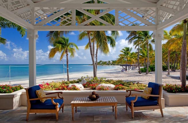 <p><em>Jumby Bay (Long) Island, Antigua</em></p>   <p>This presides over a 300-acre private island two miles off the , accessible only by boat. After stopping at Jumby Bay Beach or at the SENSE® spa, nourish your body and soul at the exemplary restaurants. The Pool Grille and Verandah marries the flavors of the Mediterranean to lighter, market-fresh ingredients. The men’s-clubby, stone-and-mahogany Estate House, built circa-1830, channels bygone British colonial glamour. Executive Chef, Sardinian-born Claudio Melis, who has manned kitchens in six Michelin-honored restaurants, has taken its kitchen to a rarified level. His food is distinguished by gorgeous tastes and textures---subtle to lusty, crispy to creamy. Sly touches include parmesan popcorn with the otherwise classic beef carpaccio. Don't miss stunners like <em>polipo e fagioli</em> (tender octopus and beans); roasted butternut ravioli with truffle butter, parmesan and amaretto cookies; and, especially, the <em>maiale</em> – local famer’s pork, Savoy cabbage, prunes, and dried mushroom.</p>   <p><strong>Insider Tip:</strong> Pack white for the resort’s White Night Sunday barbecue and dance party: It is Gatsby-meets-Caribbean.</p>   <p><strong>Plan Your Trip: </strong>Visit </p>