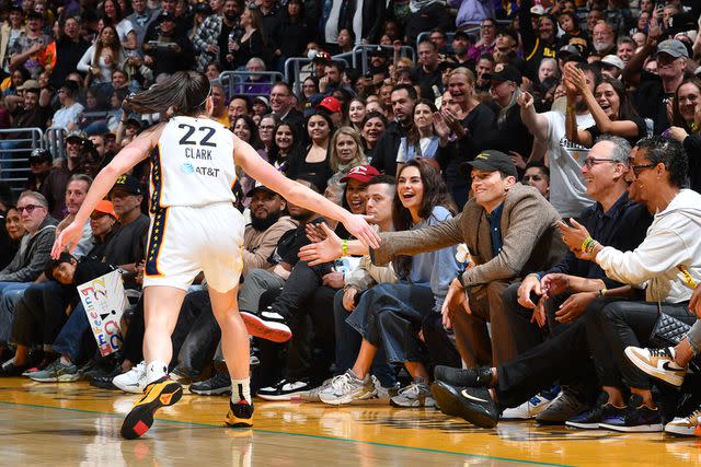 <p>Juan Ocampo/NBAE via Getty Images</p> The family cheered on Clark during the match