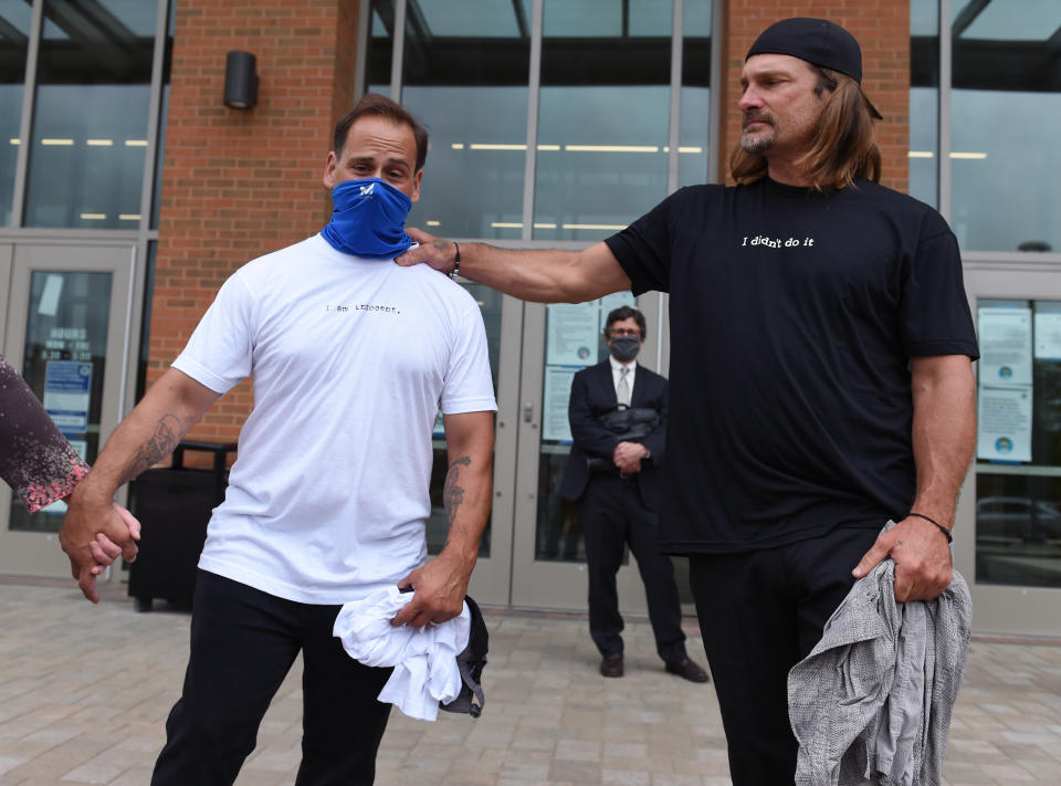 FILE - Ralph Birch, left, and Shawn Henning, speak to the press on the steps of Connecticut Superior Court in Torrington, Conn., Friday, July 10, 2020. A federal judge on Friday, July 21, 2024, has found famed forensic scientist Henry Lee liable for fabricating evidence in a murder case that sent the two men to prison, one for more than three decades, for a crime they did not commit. Birch and Henning were convicted of felony murder in the Dec. 1, 1985, slaying of 65-year-old Everett Carr, of New Milford, based in part on false testimony about blood stains on a towel. (Brad Horrigan/Hartford Courant via AP, Pool, File)