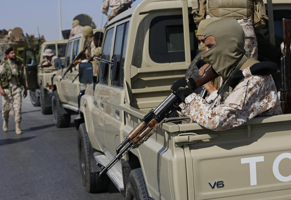 Forces loyal to Abdul Hamid Dbeibah, one of Libya’s two rival prime ministers, secure the streets of the capital, Tripoli, Tuesday May, 17, 2022. Clashes broke out in Tripoli after Dbeibah’s rival, Prime Minister Fathi Bashagha, announced his arrival in the city on Tuesday morning. But Bashagha left soon after the fighting started. (AP Photo/Yousef Murad)