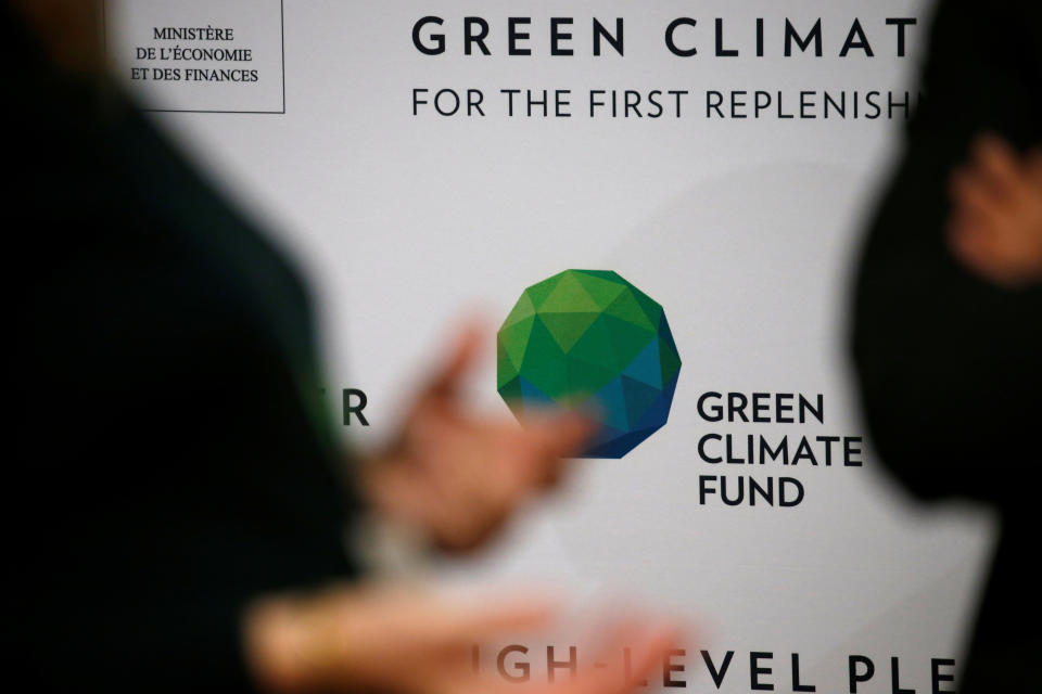 People arrive to attend the Pledging Conference of the Green Climate Fund 