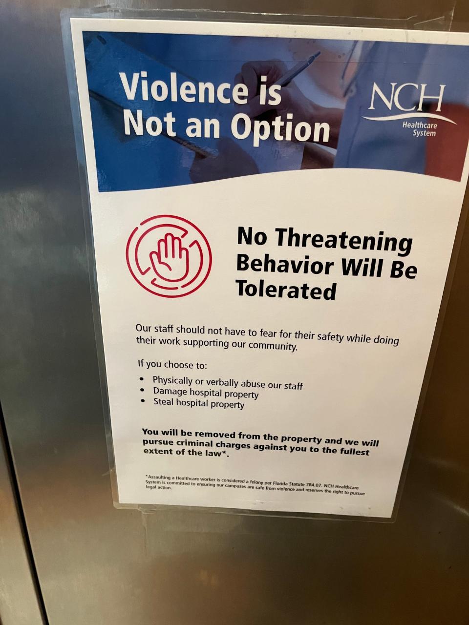 Sign inside NCH about violence not being tolerated. Signs have been posted for more than one year