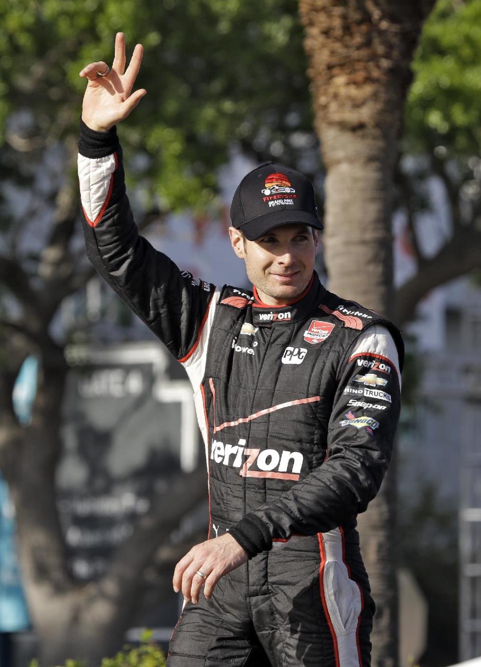 Will Power, of Australia, waves to the crowd after winning the IndyCar Grand Prix of St. Petersburg auto race, Sunday, March 30, 2014, in St. Petersburg, Fla. (AP Photo/Chris O'Meara)