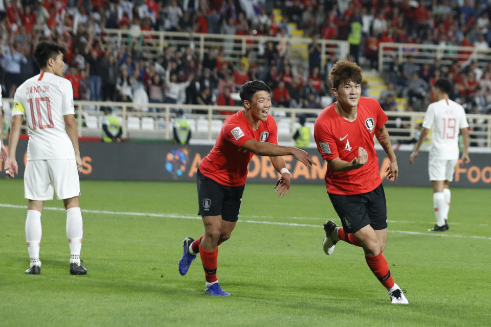 South Korea's defender Kim Min-Jae celebrates with his teammates after scoring his team's second goal during the AFC Asian Cup group C soccer match between South Korea and China at Al Nahyan Stadium in Abu Dhabi, United Arab Emirates, Wednesday, Jan. 16, 2019. (AP Photo/Hassan Ammar)
