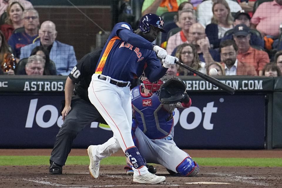 Houston Astros' Yordan Alvarez hits a home run during the second inning of Game 2 of the baseball AL Championship Series against the Texas Rangers Monday, Oct. 16, 2023, in Houston. (AP Photo/Tony Gutierrez)