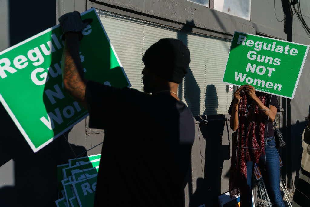  Volunteers organize abortion rights lawn signs during a 2022 campaign event for Senator Raphael Warnock. 