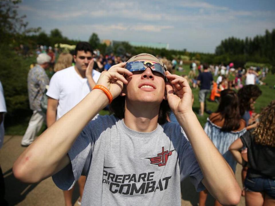 Mickey Sweeney looks at the eclipse Monday, Aug. 21, 2017 at The Arboretum at Penn State.