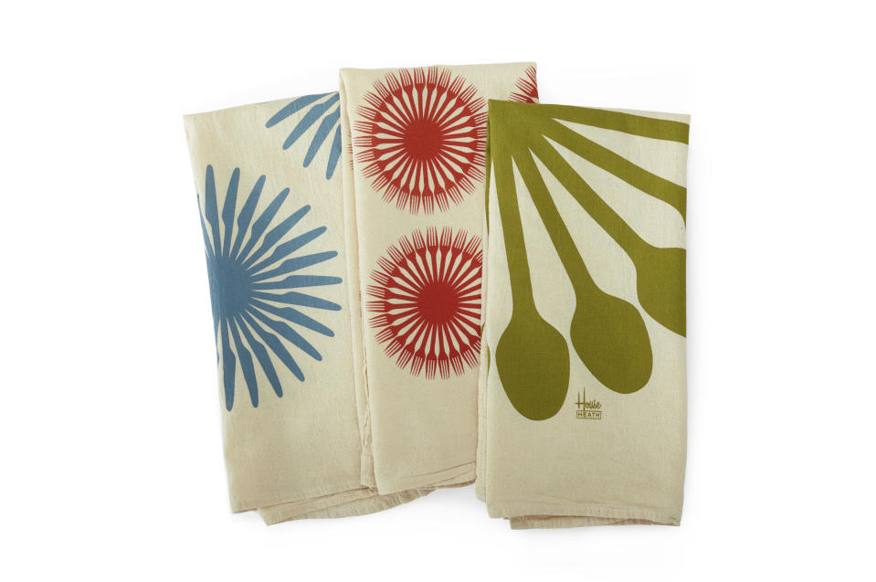 Heath Ceramics has a set of three soft, lint-free and absorbent flour sack towels, shown here, printed with hip, bold flatware graphics designed by the type foundry House Industries. Instead of a small napkin, consider using larger tea towels when outdoor dining; they make nice lap covers and hand wipes. (Heath Ceramics via AP)