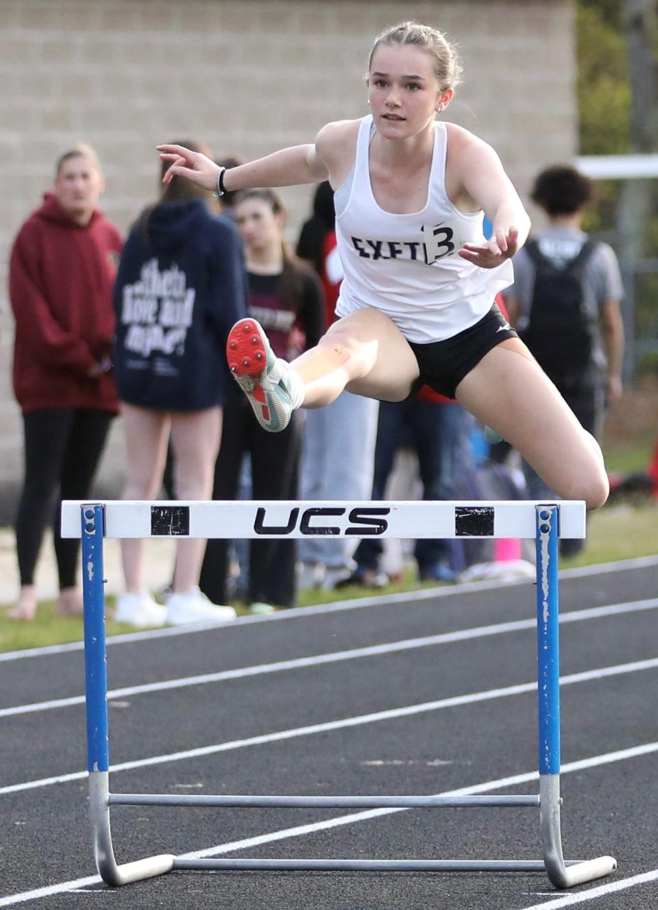 Exeter's Sydney MacVicar competes in the 300 hurdles at the Merrimack Invitational at Merrimack High School. The Blue Hawks won the girls meet with a score of 66, beating Concord by a point.