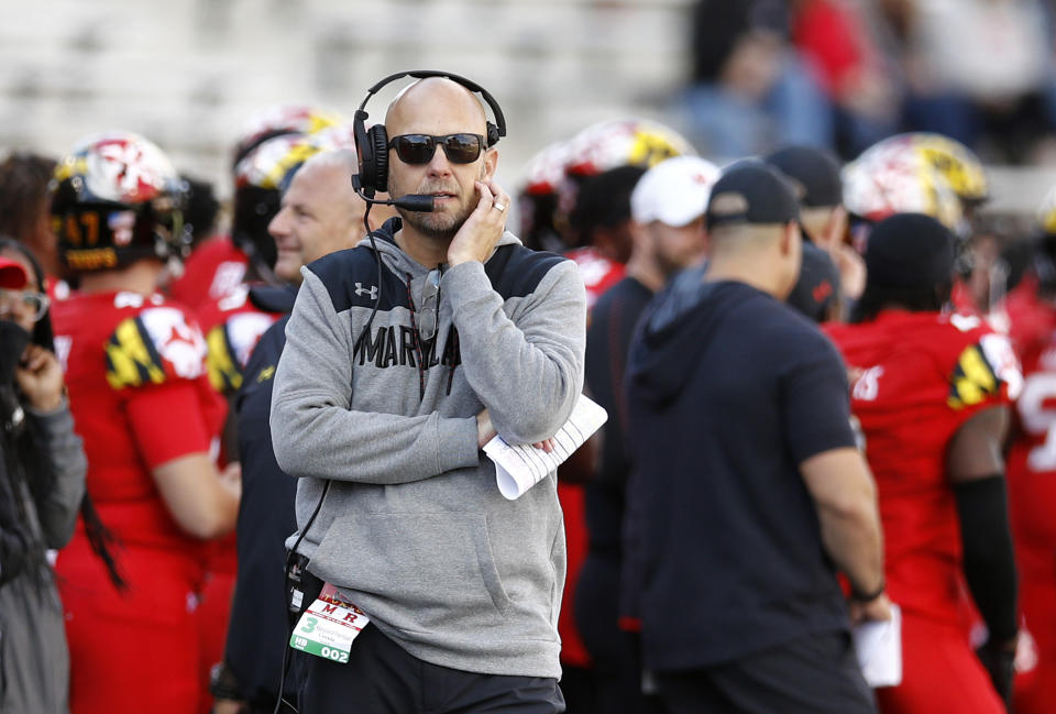 FILE - In this Saturday, Oct. 13, 2018, file photo Maryland interim head coach Matt Canada walks on the sideline during the second half of an NCAA college football game against Rutgers in College Park, Md. The Terrapins (4-2, 2-1) will be going for a second win over a ranked opponent when they visit the No. 19 Iowa Hawkeyes (5-1, 2-1) on Saturday. (AP Photo/Patrick Semansky, File)