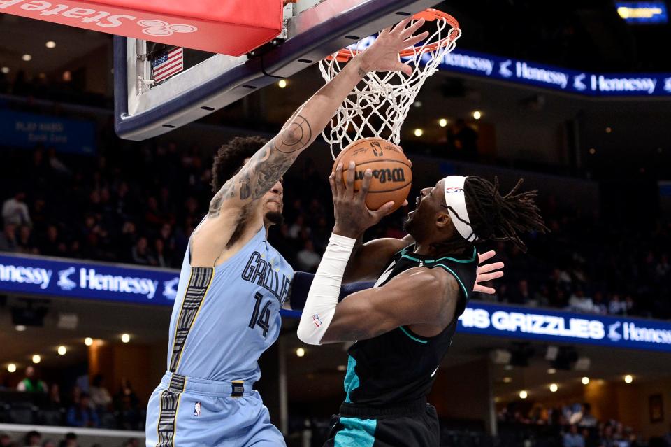 Portland Trail Blazers forward Jerami Grant (9) shoots against Memphis Grizzlies guard Danny Green (14) in the first half of an NBA basketball game Wednesday, Feb. 1, 2023, in Memphis, Tenn. (AP Photo/Brandon Dill)