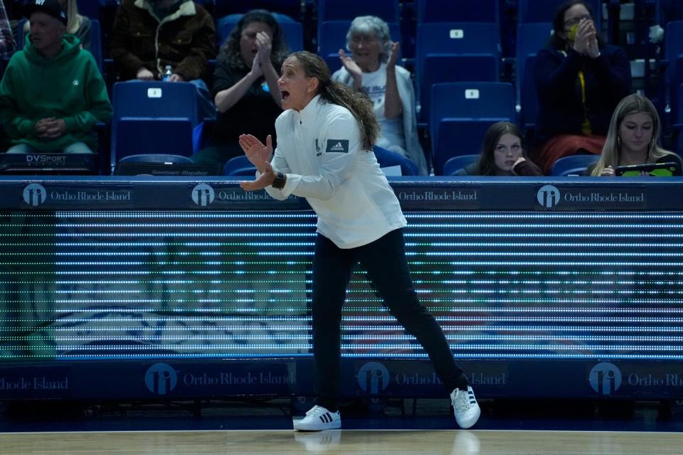 URI coach Tammi Reiss cheers on her team during Tuesday's game versus Coppin State at Ryan Center on Nov 21, 2022.  [The Providence Journal / Kris Craig]  
coach TammiReiss