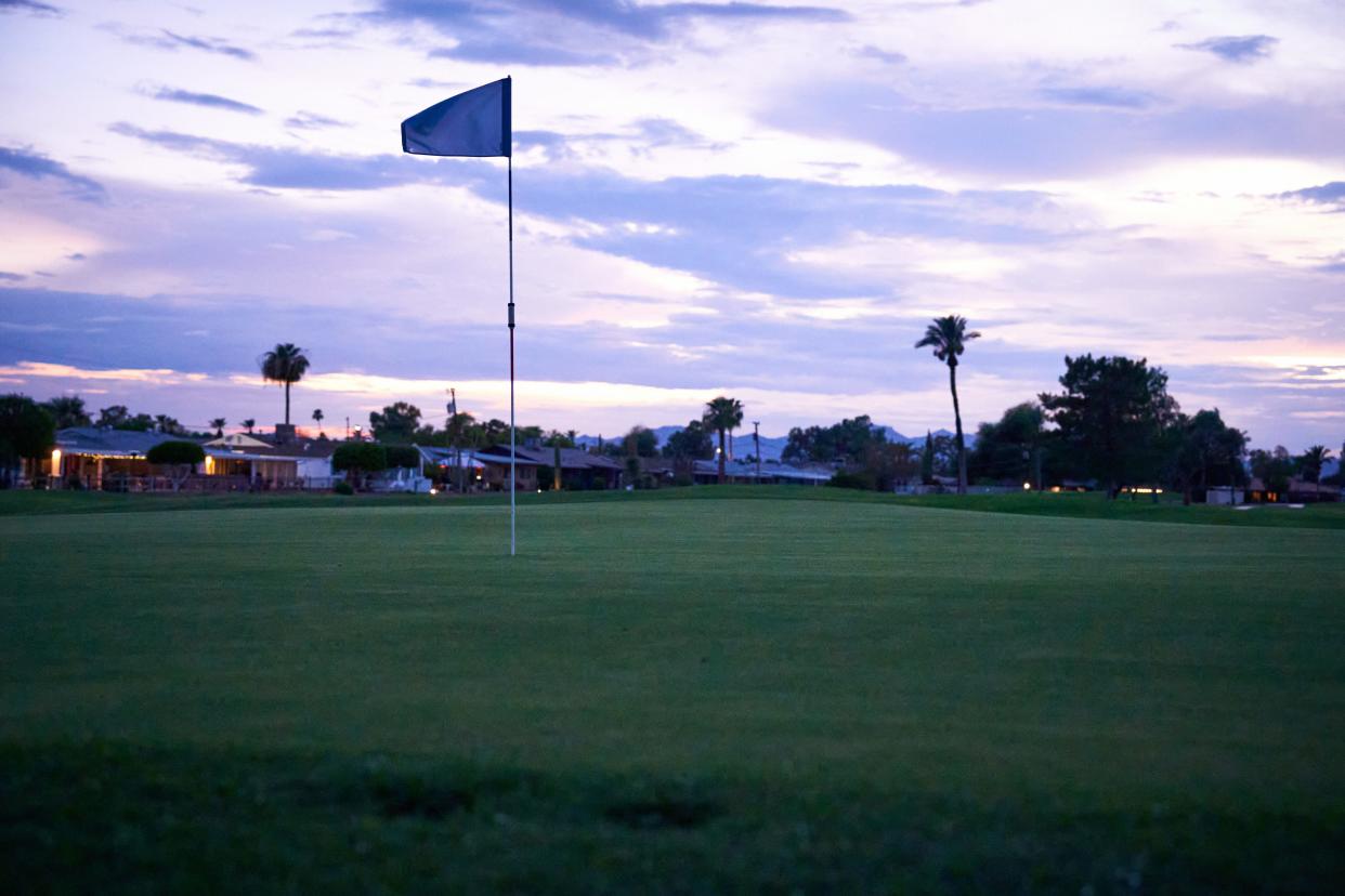 A flag billowing in the wind on the 14th hole of the Sun City South Golf Course is shown on July 26, 2022.