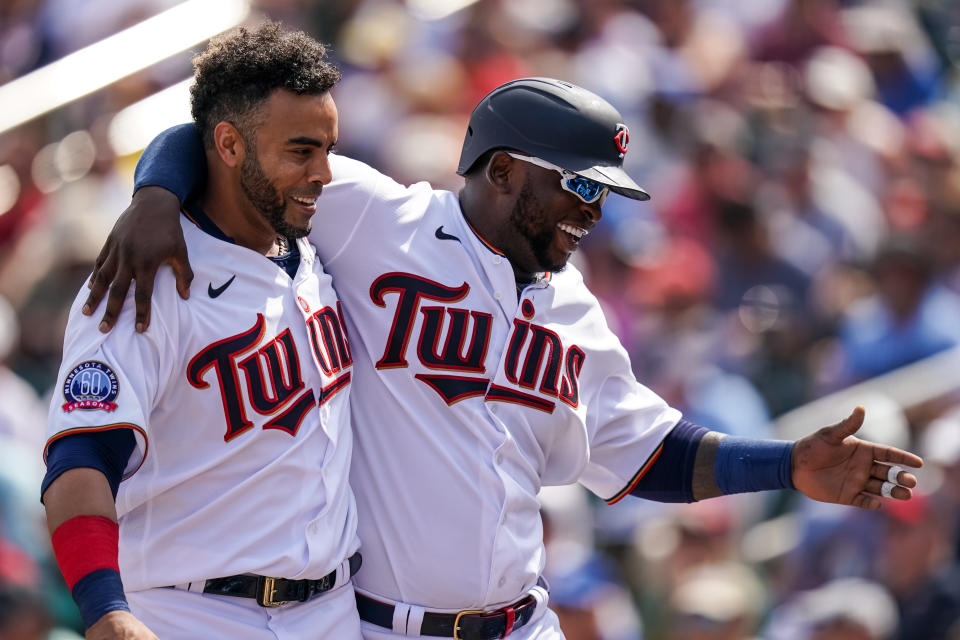 FORT MYERS, FL- MARCH 03: Miguel Sano #22 of the Minnesota Twins celebrates with Nelson Cruz #23 during a spring training game against the Detroit Tigers on March 3, 2020 at Hammond Stadium in Fort Myers, Florida. (Photo by Brace Hemmelgarn/Minnesota Twins/Getty Images)