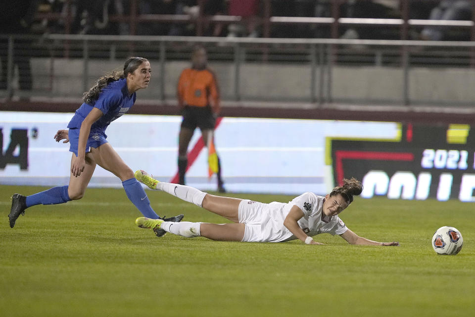 Florida State's Jaelin Howell (6) is tripped by BYU's Cameron Tucker, left, during the first half in the NCAA College Cup women's soccer final Monday, Dec. 6, 2021, in Santa Clara, Calif. (AP Photo/Tony Avelar)